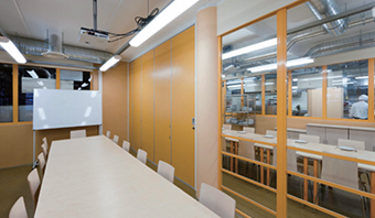 What functions can metal-laminated wall panels achieve?